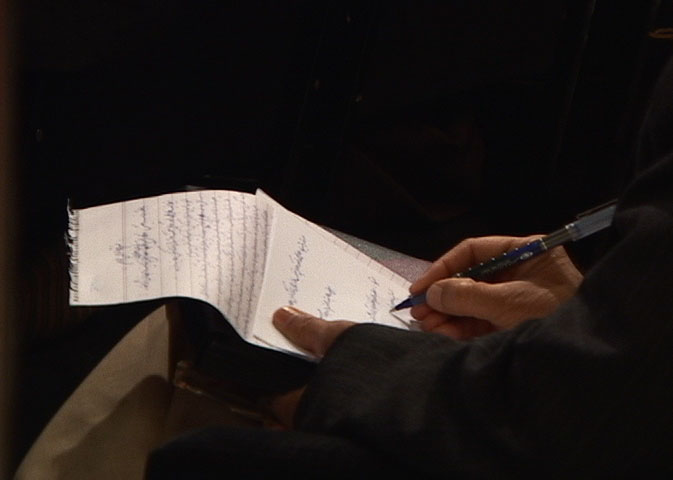 Kabul: Constitutions, video still of a delegate writing (interactive 3-channel video installation rt 1:30:00) 2005